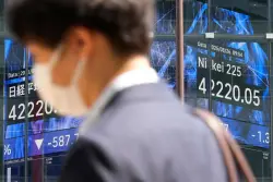 World shares sink after Trump escalates feud with the Federal Reserve