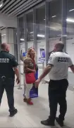 Ryanair passenger drops to her knees in tears after being denied boarding over large luggage