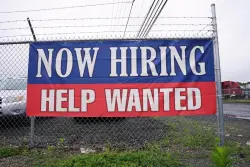 U.S. applications for jobless aid fell to 233,000 last week as layoffs remain low